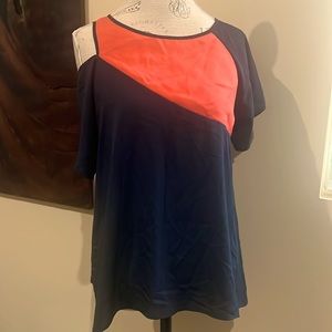 Gianni Bini. Blue and orange shirt with shoulder slit.